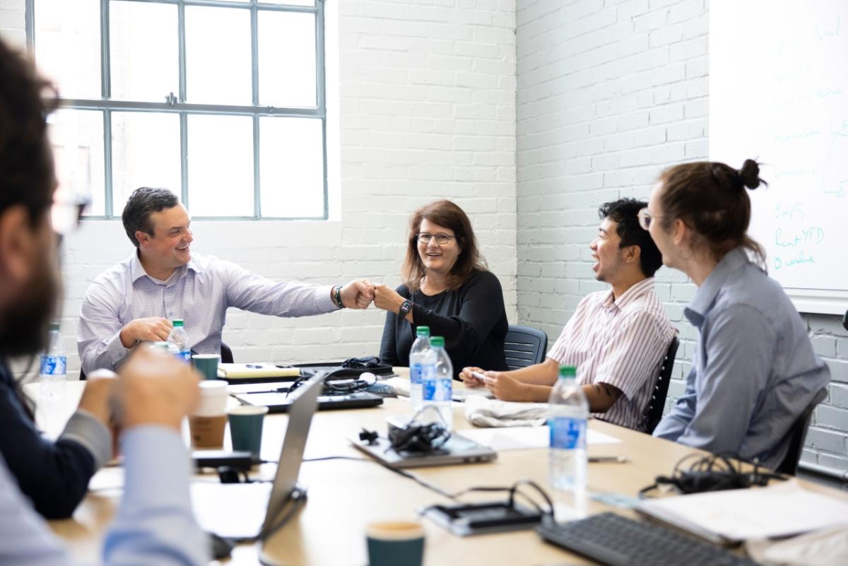 people sitting at conference table 