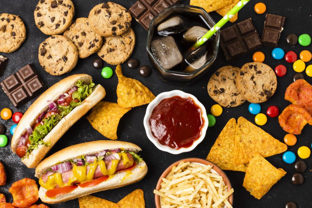 Image showing processed foods: cookies, hot dogs, candy, cheese and cookies.