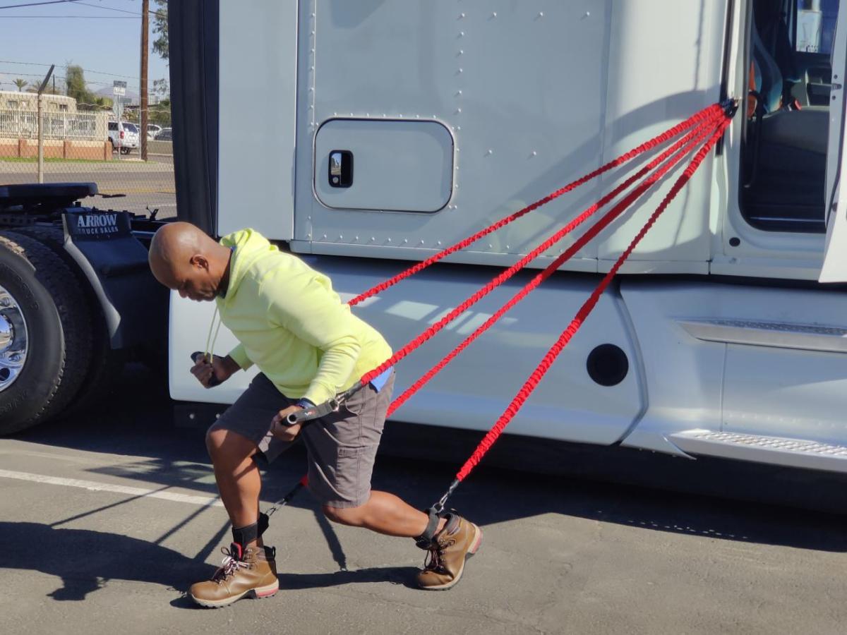 Using exercise bands tied to a truck