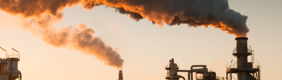 Smoke pumping out of an industrial complex