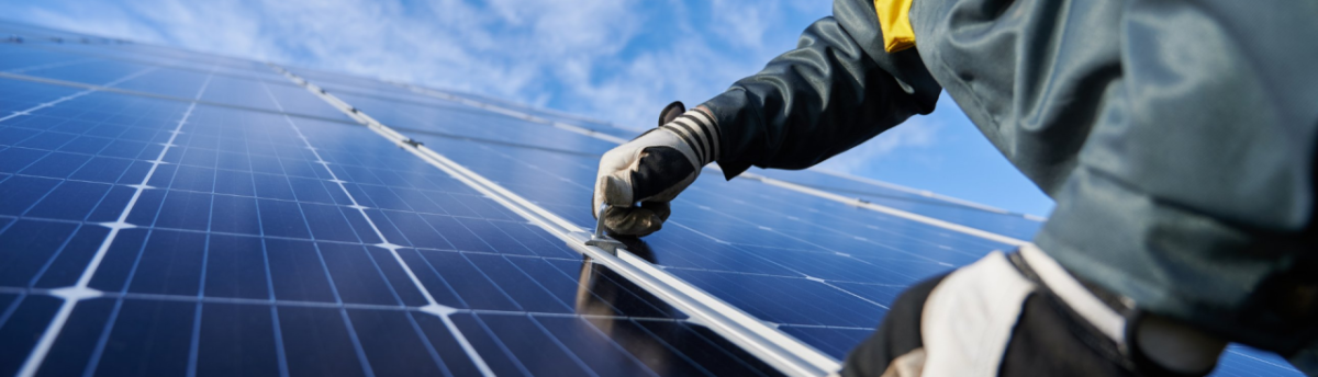 person installing solar panels