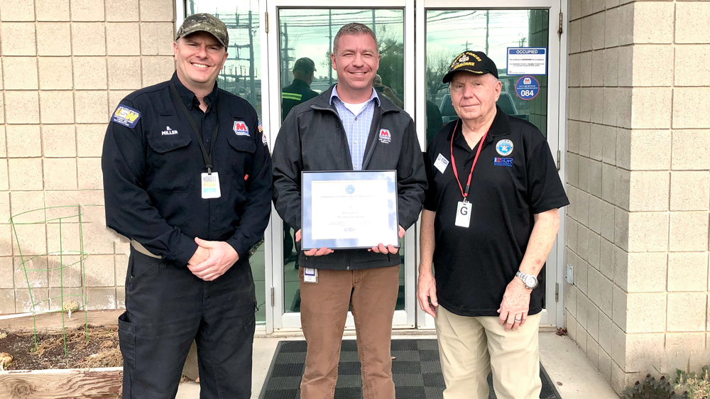 Utah ESGR Co-chair David Allen, right, presented Brent Olsen with the Above and Beyond Award alongside Brian Miller, who nominated the Salt Lake City refinery. 3 men holding plaque