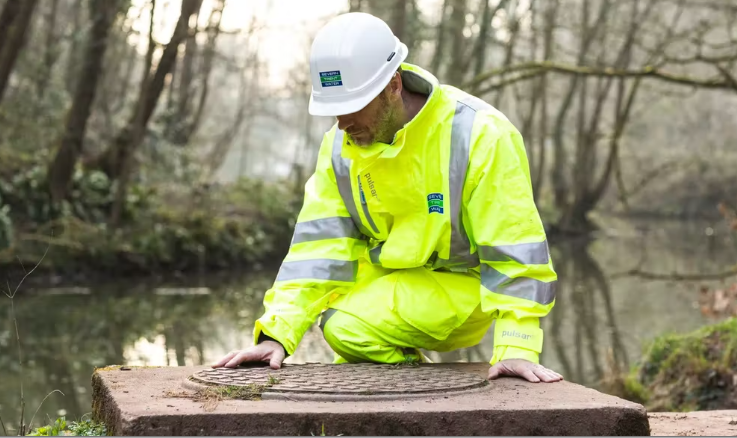 person working on water utility