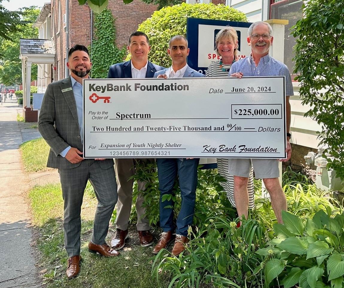 Pictured at a recent check presentation are (from left) KeyBank Market Retail Leader Nicholas Stevens, Market President Tony DiSotto, Area Retail Leader Gamal Alsalahi, Corporate Responsibility Officer Brigitte Ritchie, and Spectrum Executive Director Mark Redmond. " "