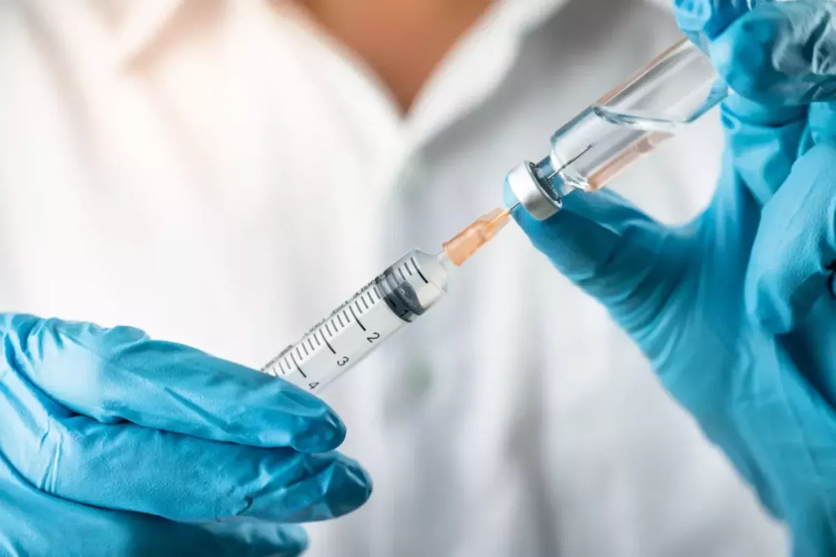health professional preparing a vaccine 