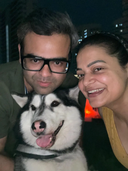 Vedant, his wife and their husky.