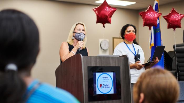 Principal Renee Fairless and Verizon Innovative Learning coach Olga Storla address the school community during the device rollout. Credit: Saeed Rahbaran