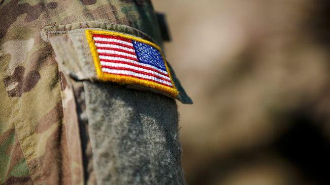 Close up of an American flag on a military uniform.