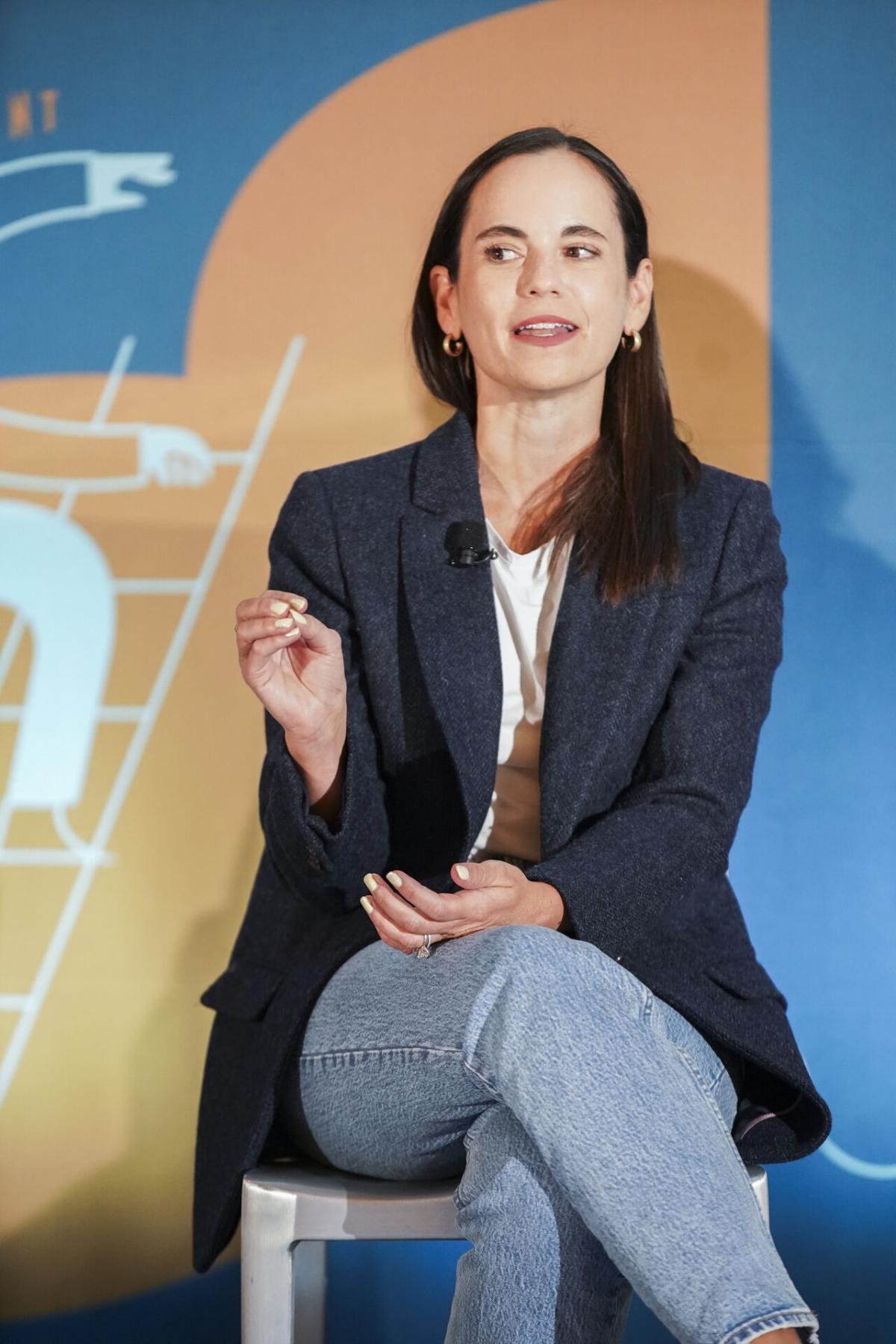 One person sitting on a chair talking