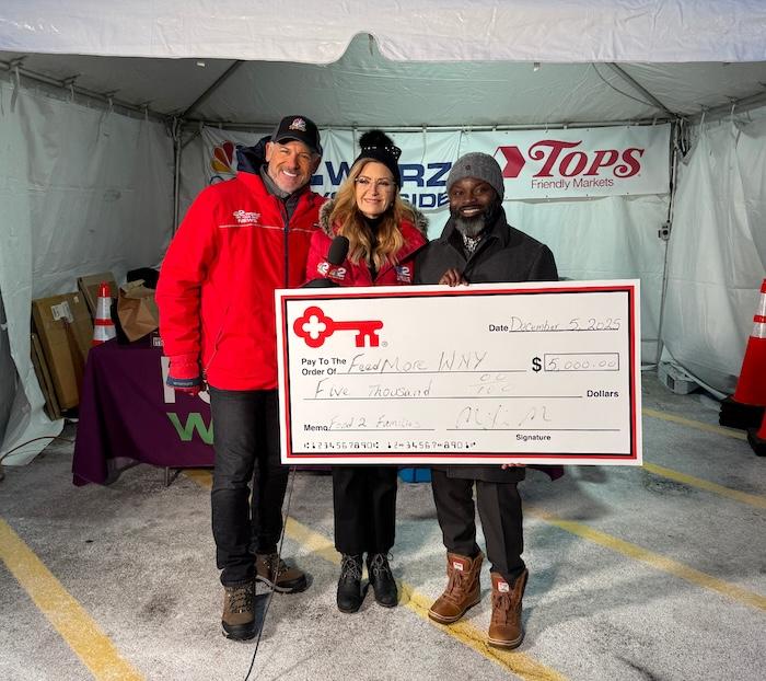 KeyBank and WGRZ Food 2 Families representatives shown with a $5,000 grant check..