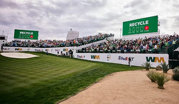 People sat watching a golf tournament