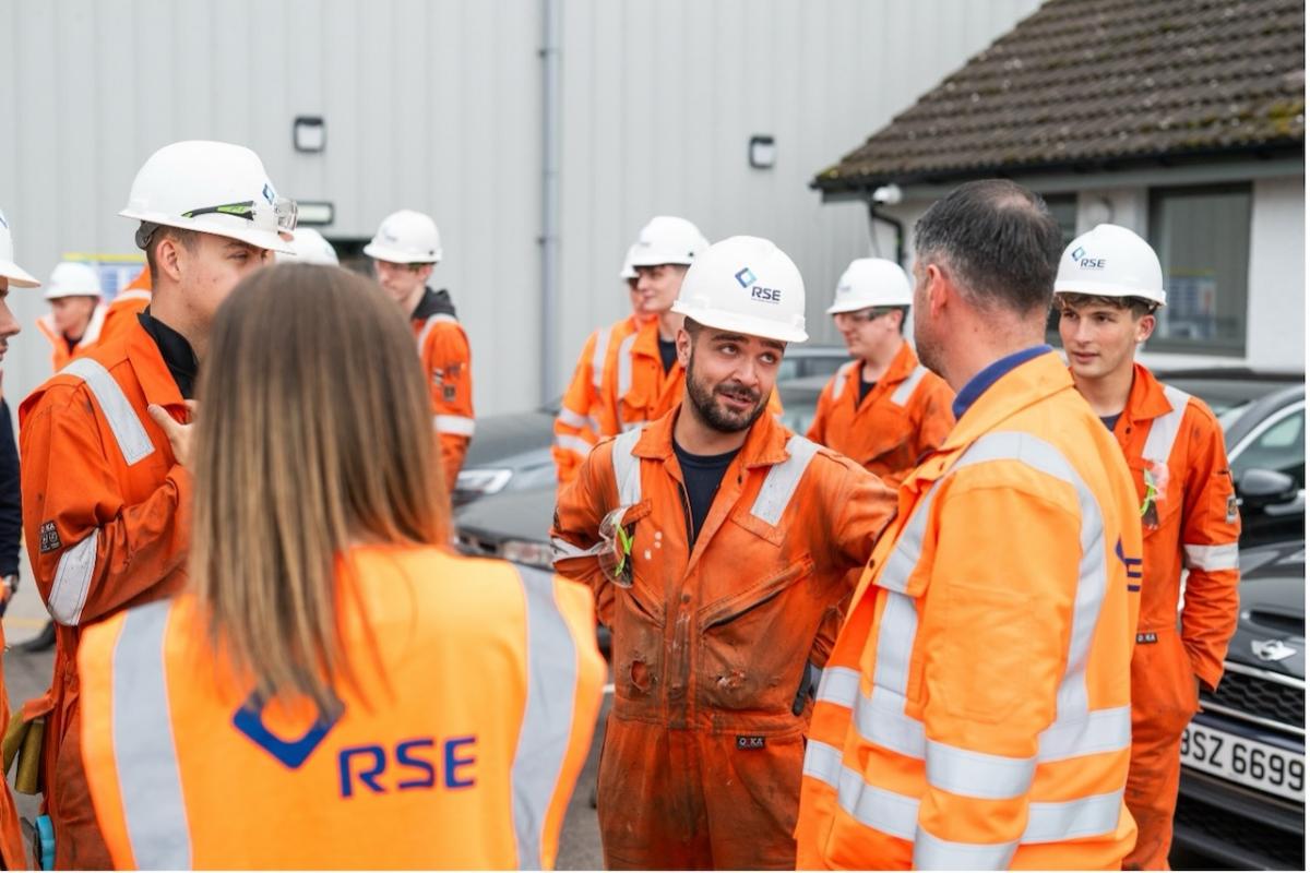 The apprentices speaking to each other.