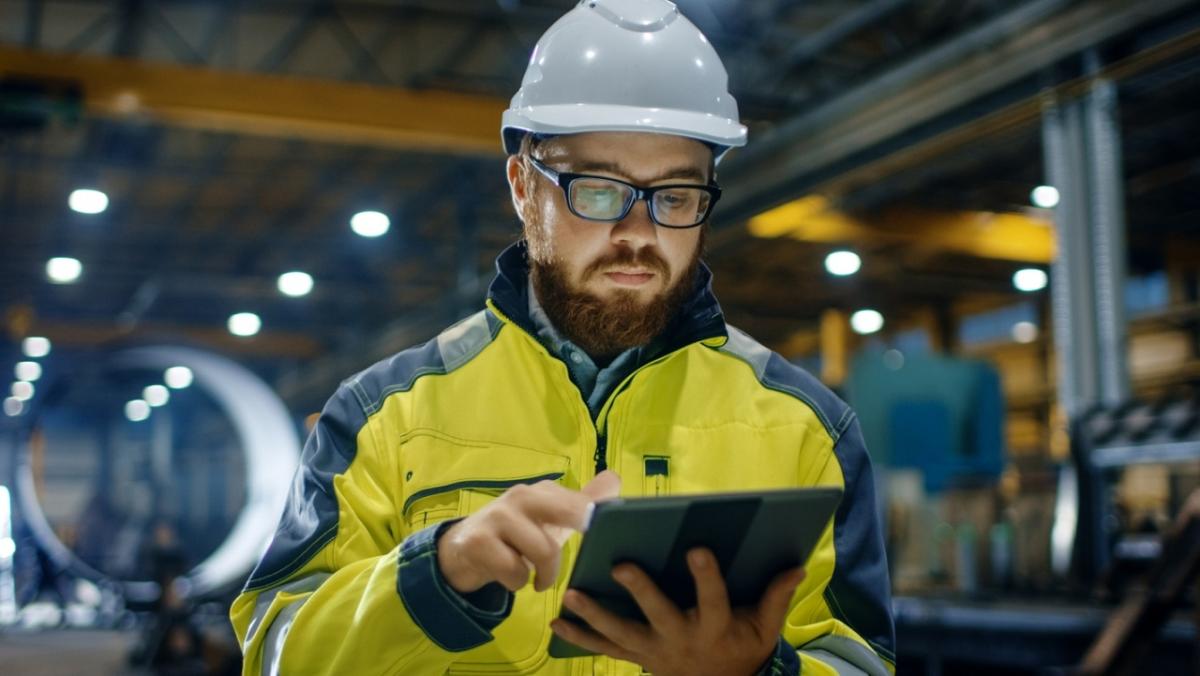 Industrial Hygienist working on tablet
