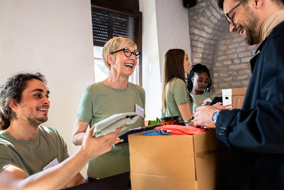 Volunteers help a customer