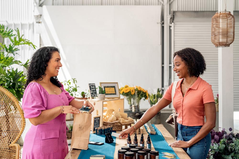 A women owned business and a customer are shown.