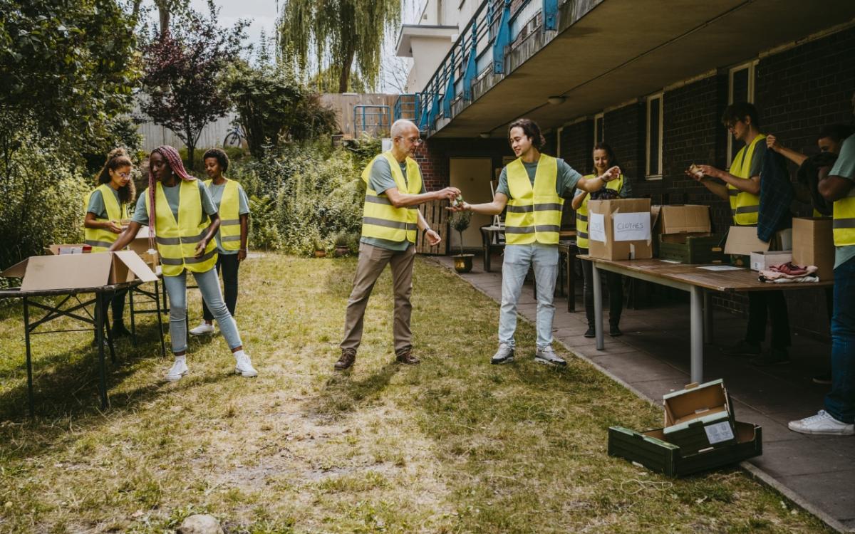 Team in reflective vests working outside at perhaps a tagsale