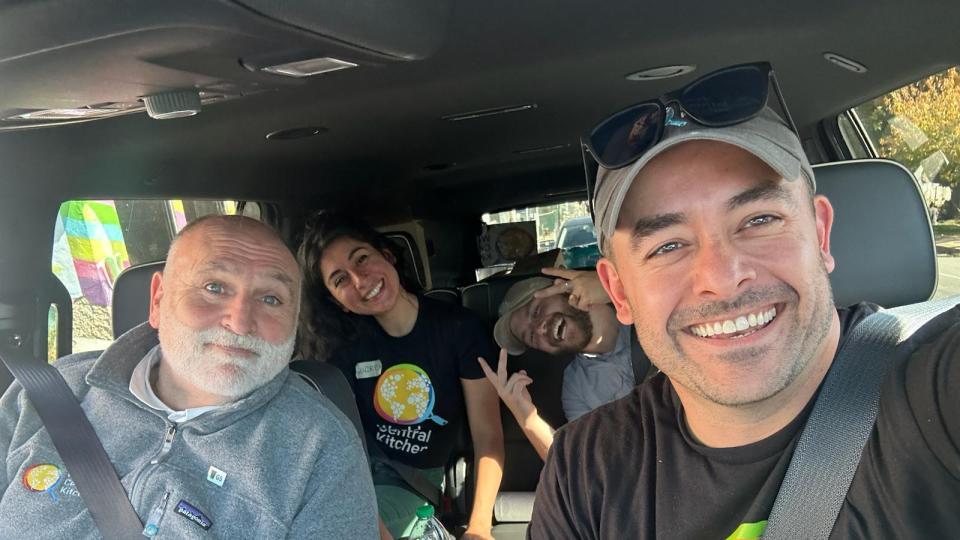 Mike Bean in a van with other volunteers
