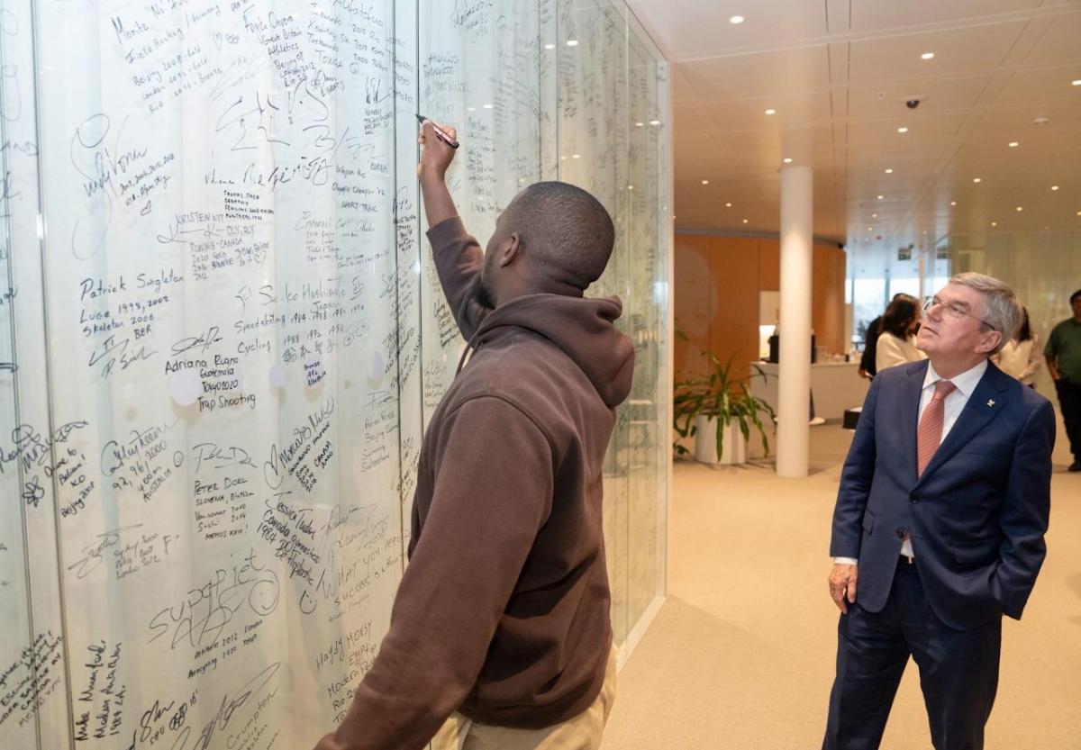 A person writing on a white board