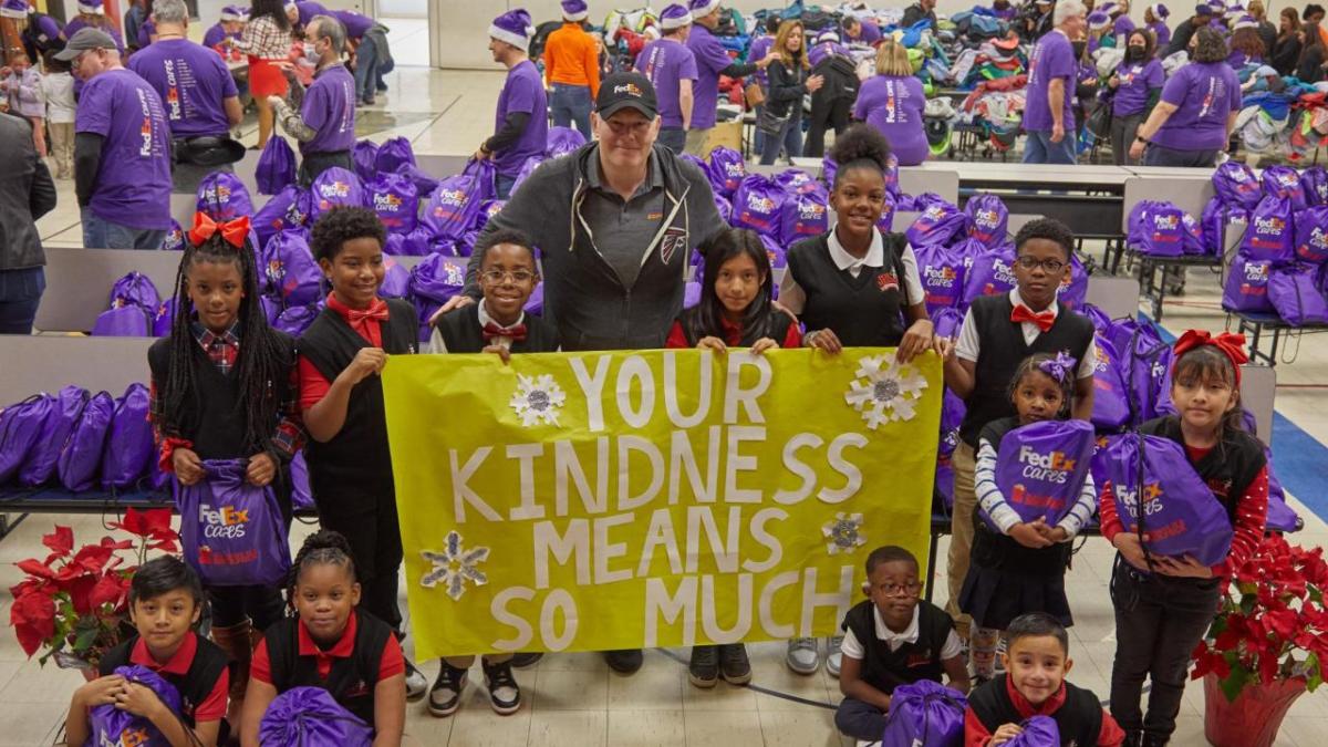 Your Kindness Means so Much sign with group smiling