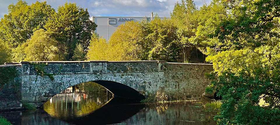 Bridge over water with Abbott building in background