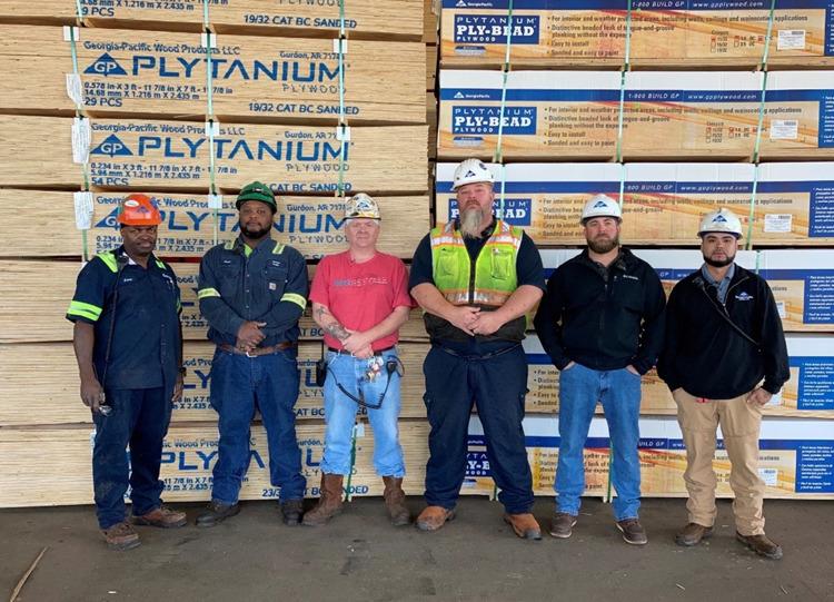 Employees pictured left to right: Jesse Welch, Jamal Tidwell, Timmy Cook, Chad Conroy, Wesley Hollingsworth, Jesus Ortiz. Not pictured, Bruce Joiner. 6 employees in hardhats