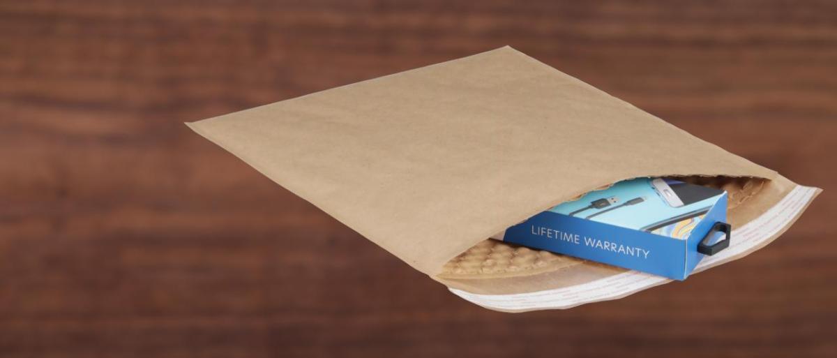SEE's BUBBLE WRAP® brand paper bubble mailer Brown paper mailing envelope with small product inside