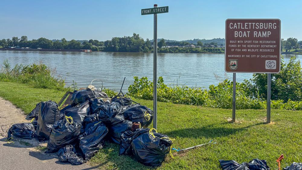 Teams from Marathon Petroleum joined community members to collect dozens of bags of trash along the riverbanks in Kentucky and West Virginia. collection bags
