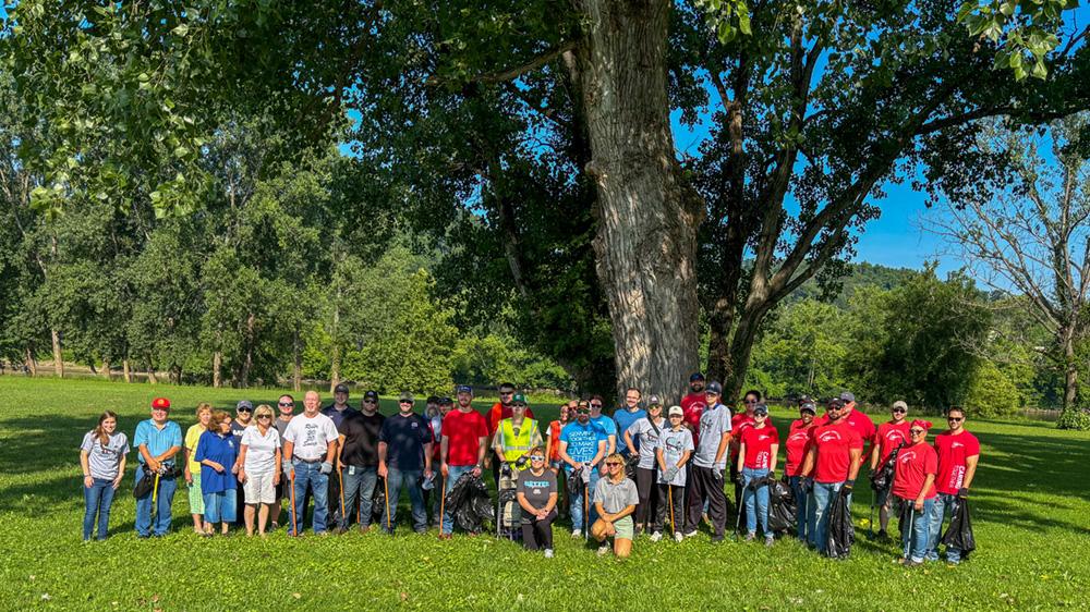 A group photo of Marathon Petroleum employees, interns/co-ops and their families who participated in the 2025 Ohio River Sweep. " "