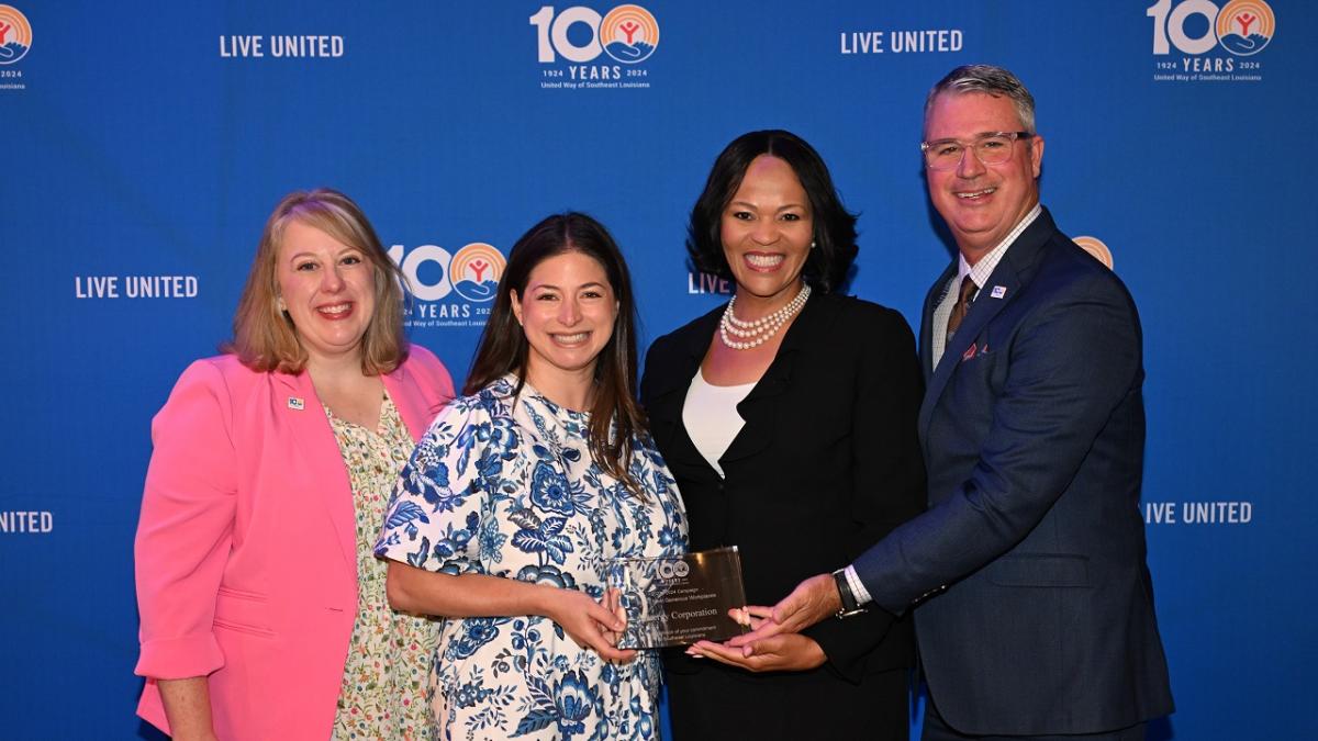 Cammie Proctor, Michelle Bourg, Sandra Miller and Michael Williamson at UWSELA's annual meeting group holding award