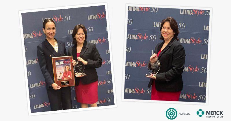 two people holding a plaque and award