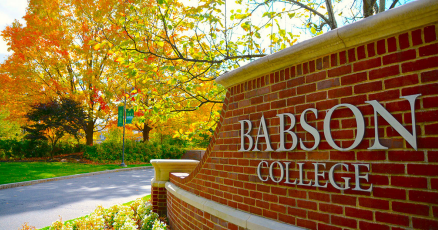 Babson College sign on a brick wall.