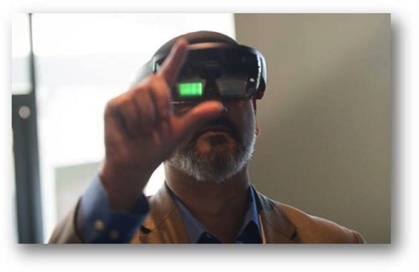 Nirav Desai, chief technologist at Booz Allen, experimenting with his augmented reality headset.