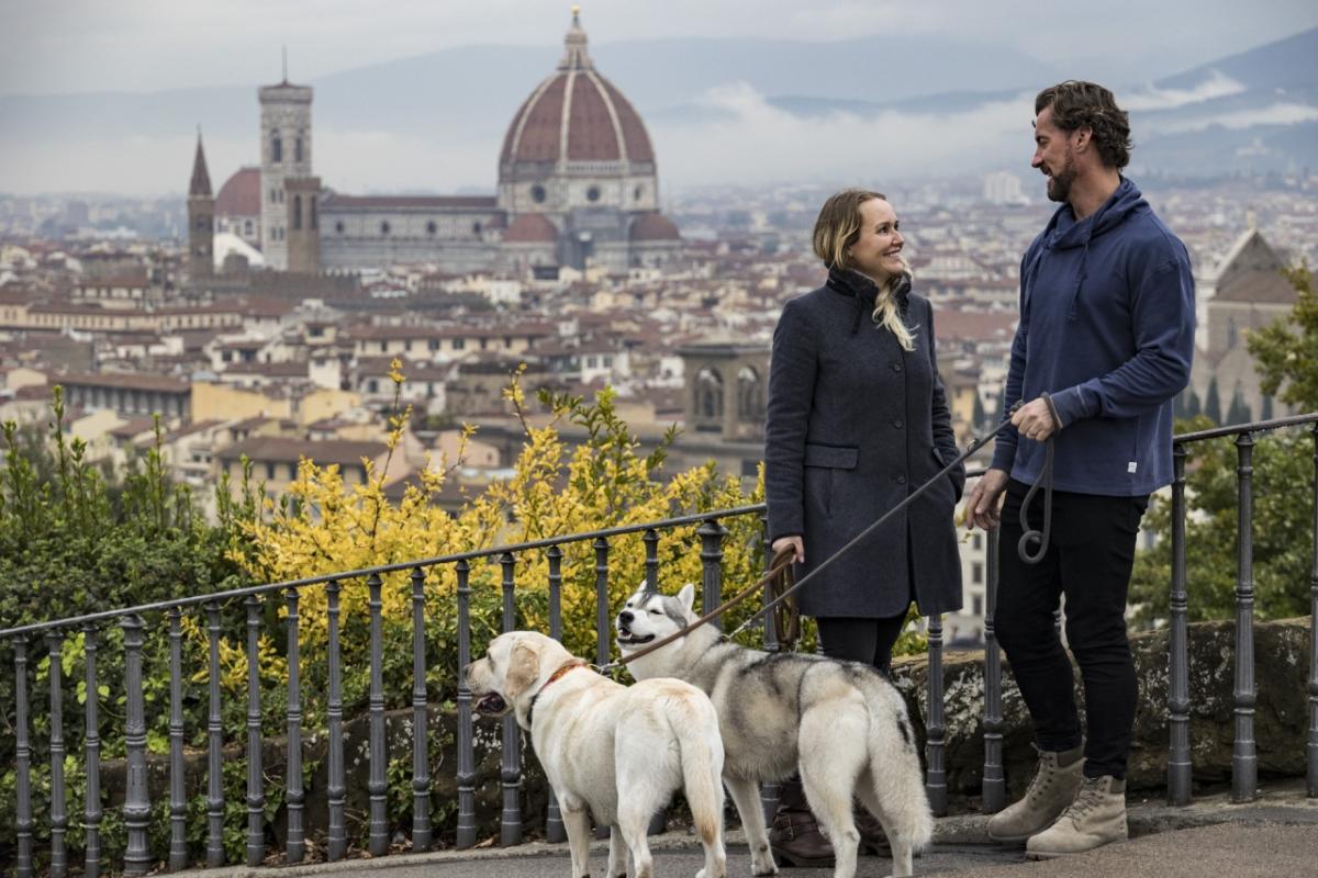 Stefanie and Steve walking their two dogs in Florence, Italy
