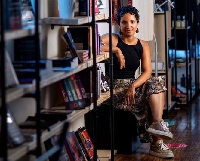 A person sitting in a bookstore