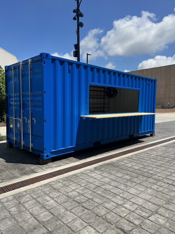 Blue up-cycled shippping container mobile retail space