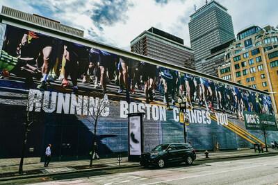 Large mural on the side of a building "Running Boston Changes You".