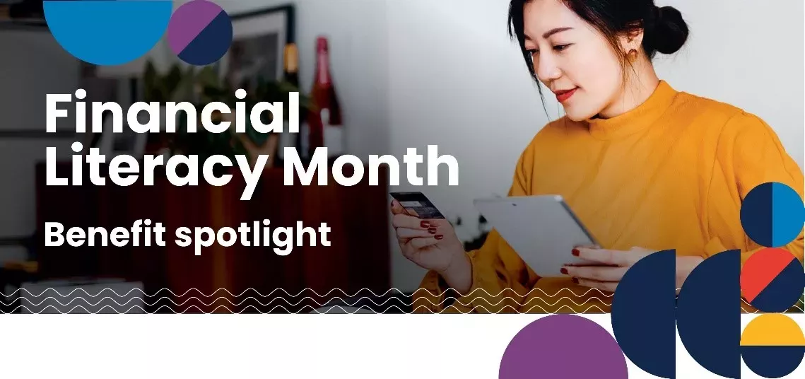 A person looking at a piece of paper and credit card. "Financial Literacy Month Benefit Spotlight"