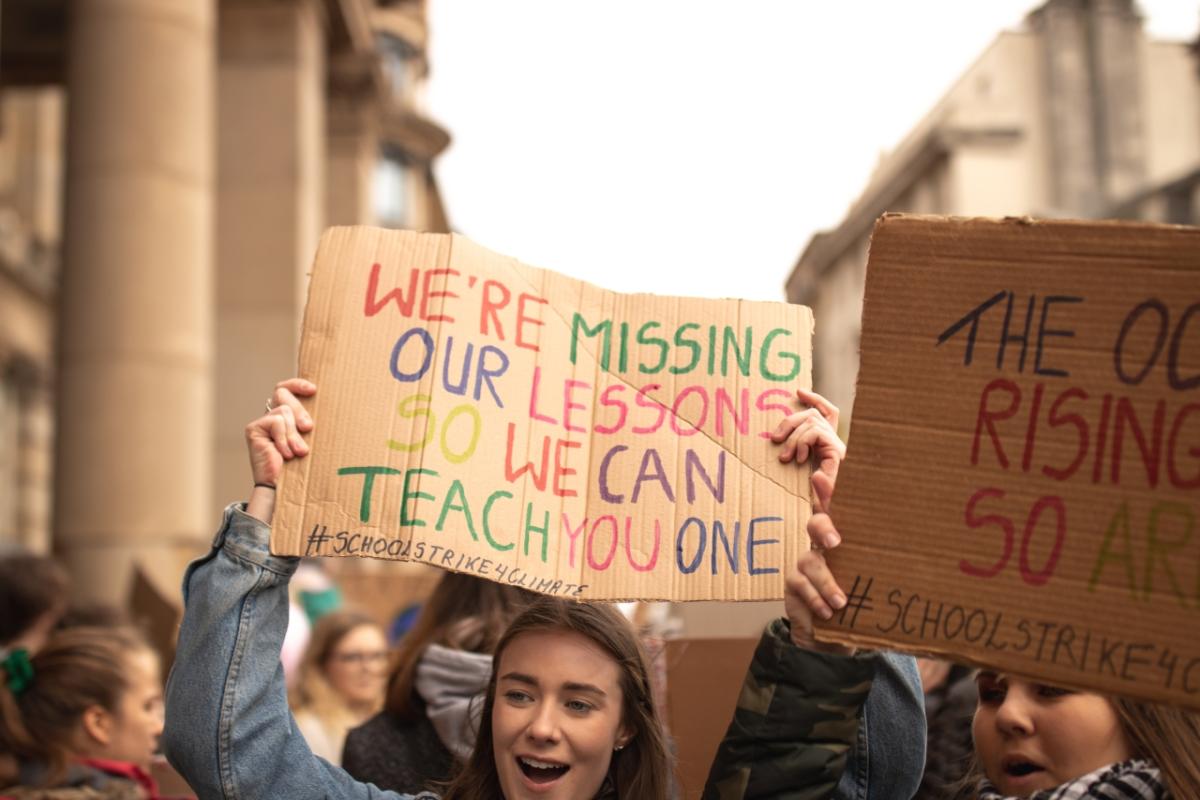 Photo by Callum Shaw Gen Z woman at a march