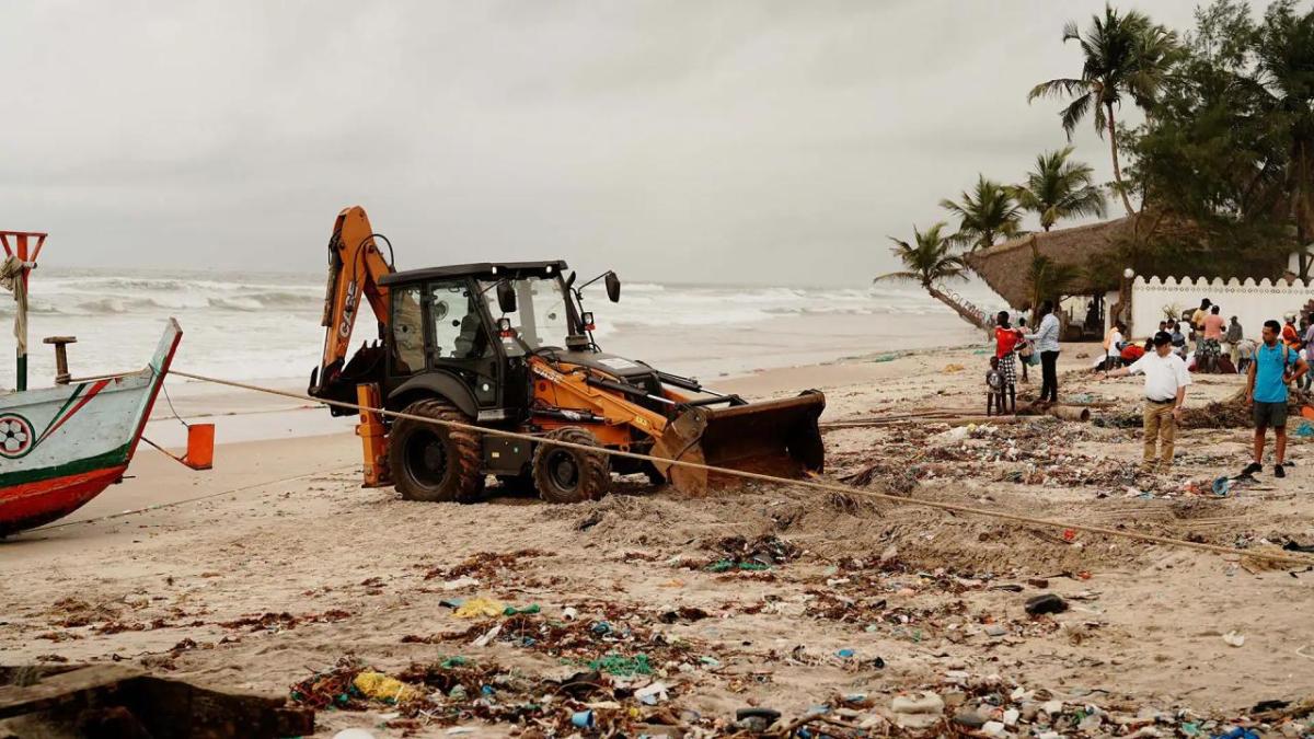 A piece of machinery being used to help clean up the beach