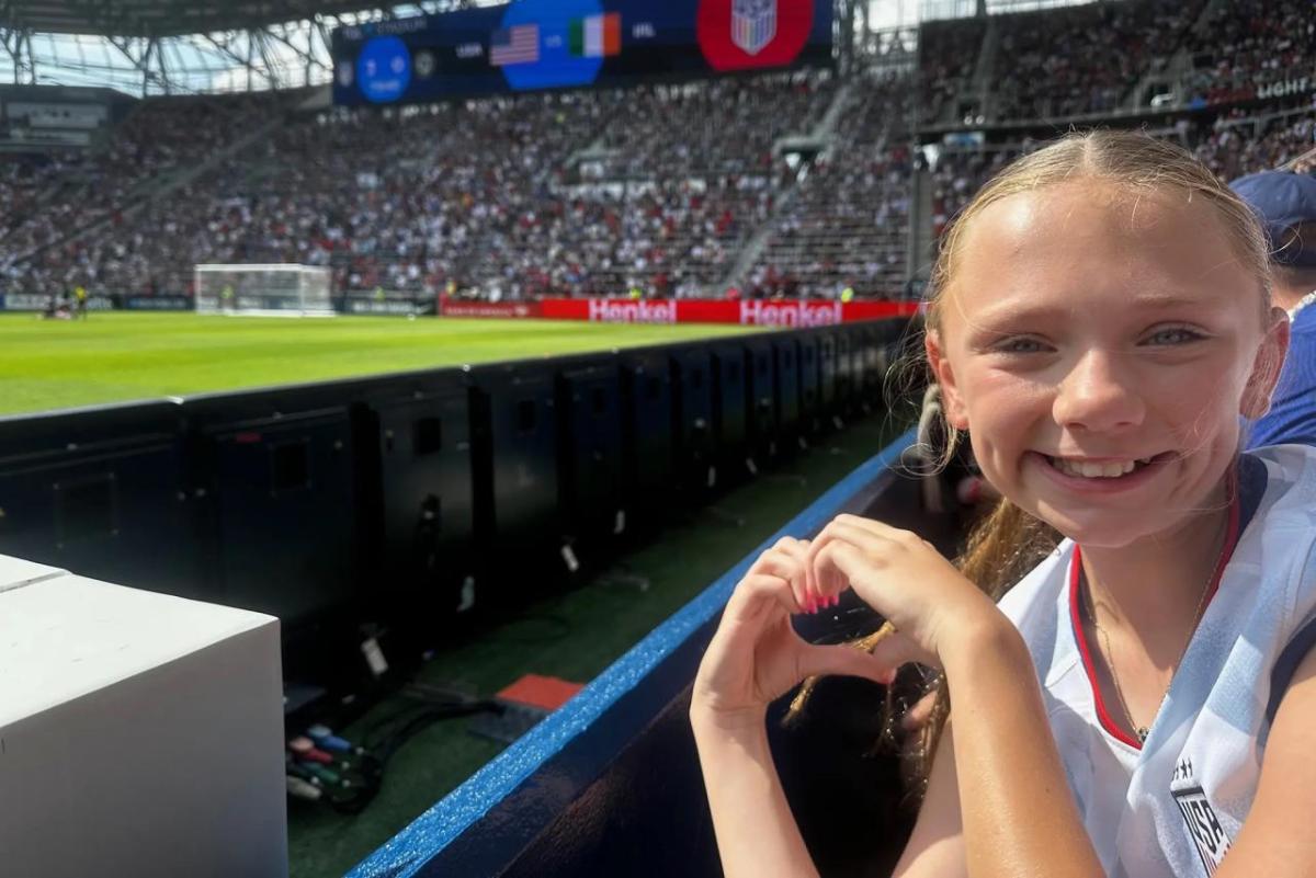 person in audience for soccer game