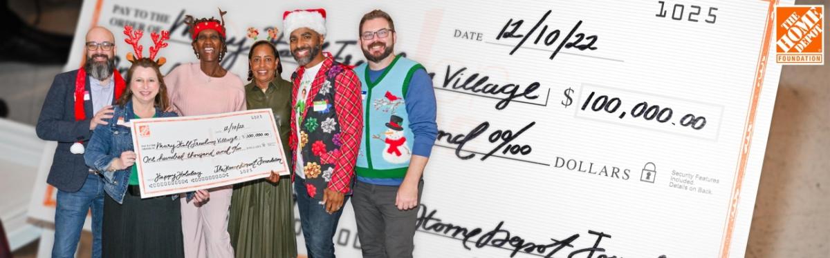 group in festive clothing with an oversized check