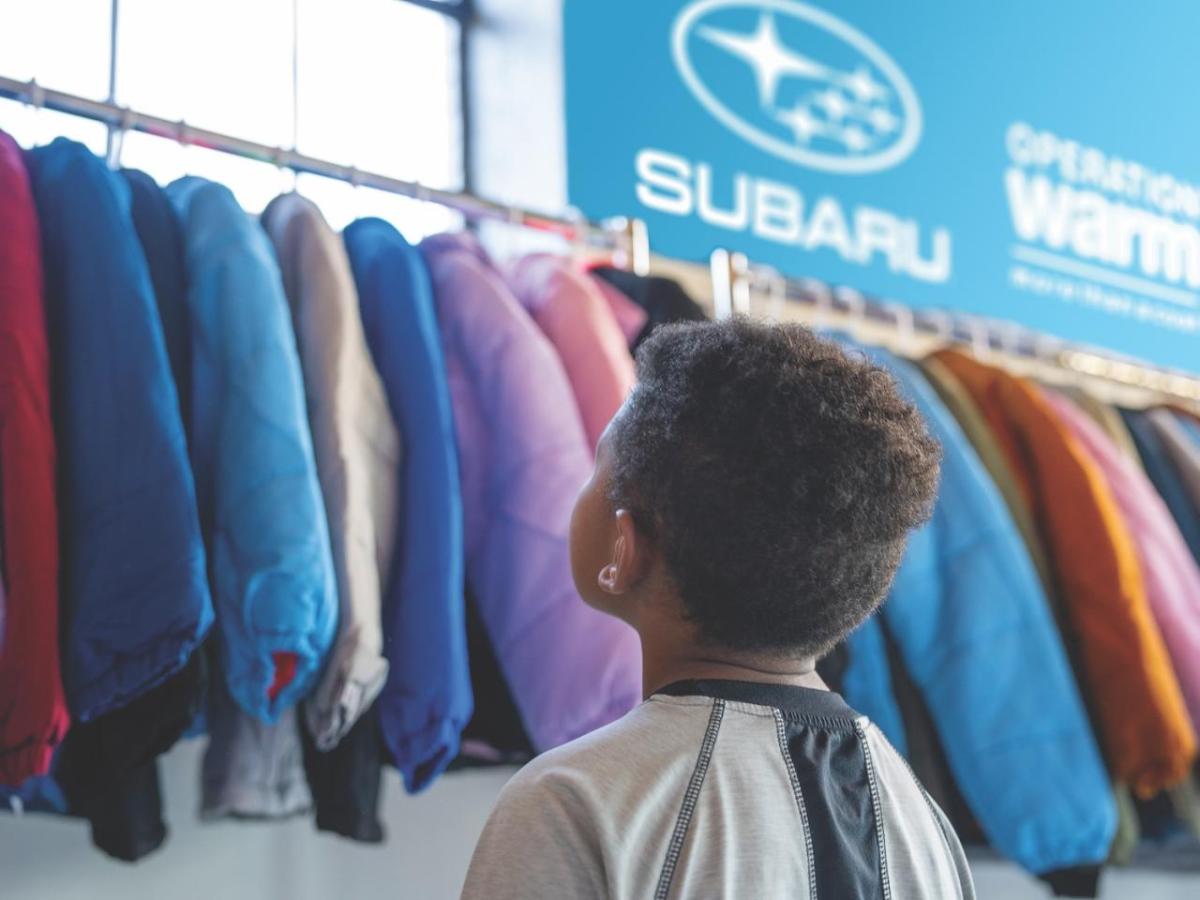 child looking at jackets
