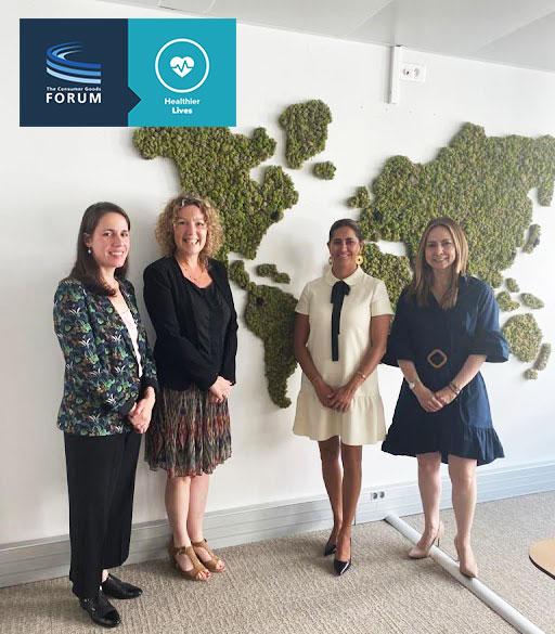 4 women in front of a map of the world