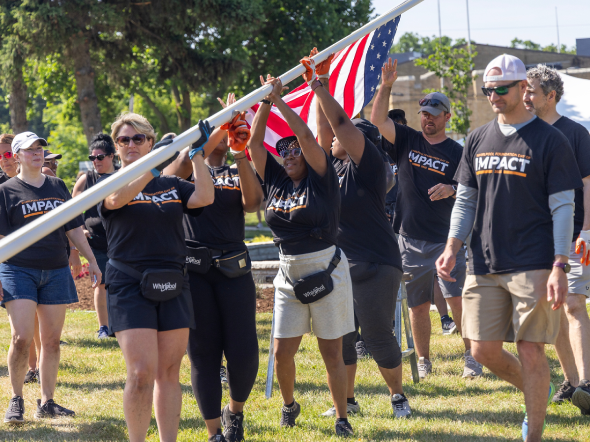 A group raising an American flag