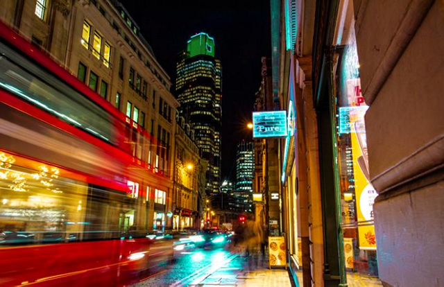 Photo of a city with a blurred image of bus