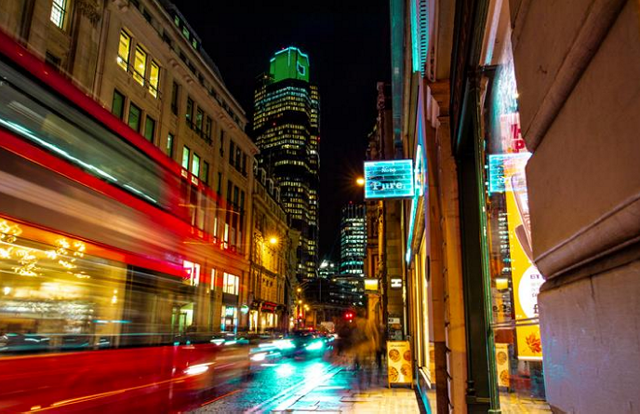 Photo of a city with a blurred image of  bus