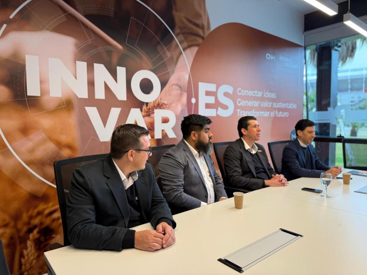 4 people seated at a conference table