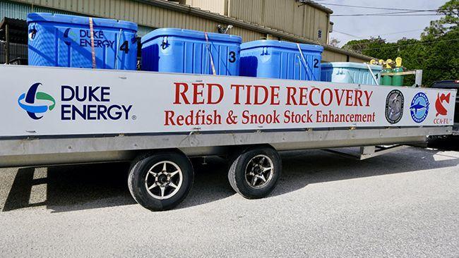 Trailer carrying blue containers