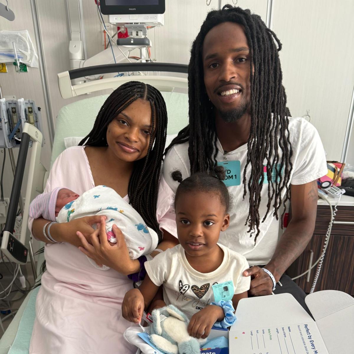 Baby and parents celebrating Fifth Third Baby