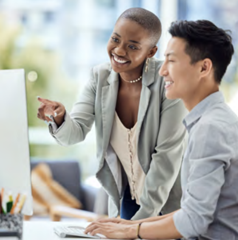 LyondellBasell employees smiling together at computer screen